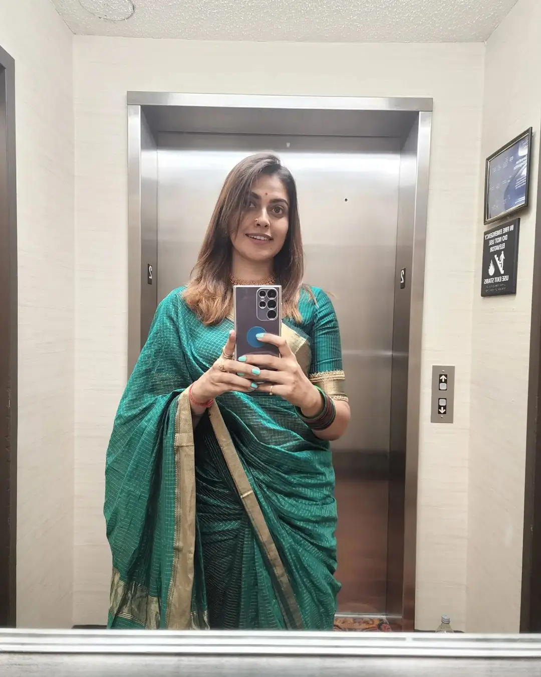 Anusree Nair Wearing Beautiful Earrings Jewellery Green Saree Blouse